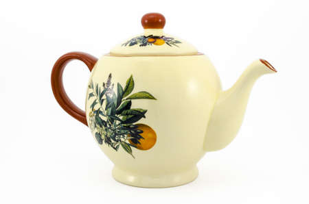 ceramic teapot cream color with a patternの写真素材