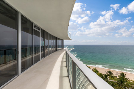 viewpoint of balcony overlooking the sea and miami beach, horizon line turquoise sea and blue skyの写真素材