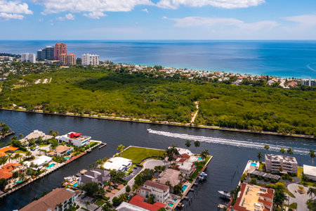 Aerial drone view of Miami urban area, bay with blue sky, clouds and skyline, cityscape backgroundの写真素材