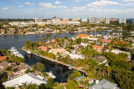 Aerial view of modern luxury houses in sunrise key neighborhood in fort lauderdale of miami, tropical climate view of bay with boatsの写真素材
