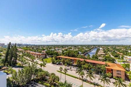 Aerial drone view of the coastline of the Galt Mile neighborhood, in Fort Lauderdale, beach with modern buildings, towers, palms, modern buildings and towers, blue skyの写真素材