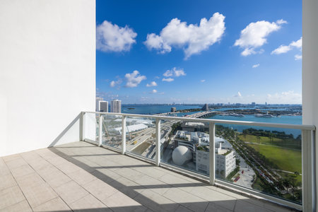 Balcony shot of the commercial area in downtown Miami, parks, bridges, cars, modern buildings, museums, towers, piers, bridges and blue skyの写真素材