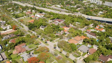 Aerial drone Shots in Miami, USA, commercial area, luxury houses, buildings and mansions, abundant tropical vegetation around and blue sky.の写真素材