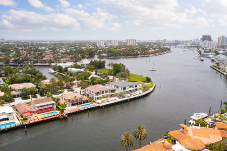Aerial drone Shoot in USA, commercial area, luxury houses, buildings and mansions, abundant tropical vegetation around, blue sky and Ocean.の写真素材