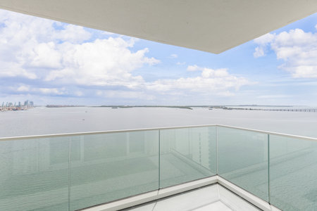 Contemporary Balcony Photoshoot located in Florida, USA. Showcasing modern architectural design and development. Beautiful clear Skyline, commercial area view with canals and beachの写真素材