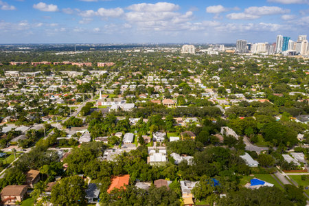 Aerial drone photoshoot Footage in Florida, USA, commercial area, luxury houses, buildings and mansions, abundant tropical vegetation around, beautiful blu sky.の写真素材