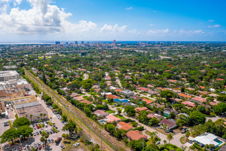 Aerial drone photoshoot Footage in Florida, USA, commercial area, luxury houses, buildings and mansions, abundant tropical vegetation around, beautiful blu sky.の写真素材