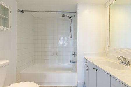 Bathroom interior with white bathtub and shower. Nobody insideの写真素材