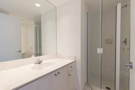 Interior of a modern bathroom with white bathtub and shower. Nobody insideの写真素材