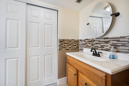 Bathroom interior with vanity cabinet and mirror. Northwest, USAの写真素材