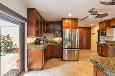 Kitchen with wood cabinets and stainless steel appliances. Northwest, USAの写真素材