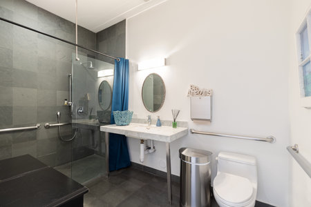 Interior of a bathroom in a new house, bathtub and toiletの写真素材