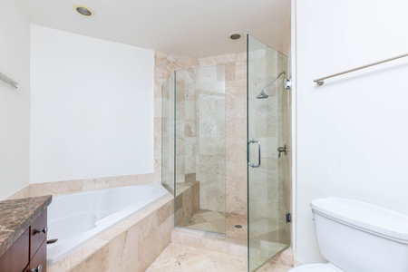 Interior of a bathroom with bathtub and shower. Nobody insideの写真素材