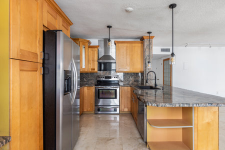 Interior of a new house, modern kitchen with wooden countertopの写真素材