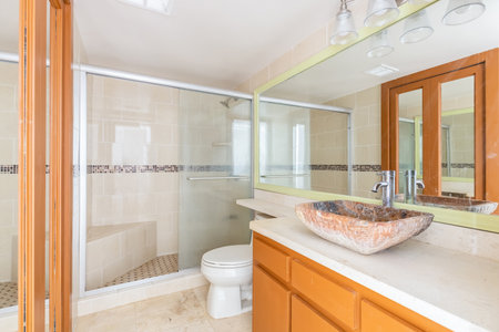 Interior of a modern bathroom with orange and white tile. Nobody insideの写真素材