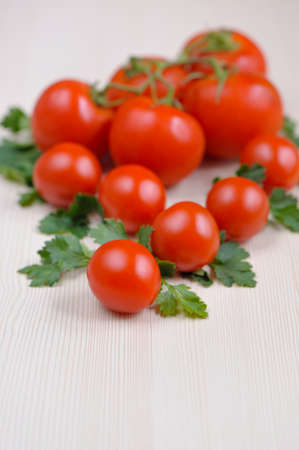 light background with cherry tomatoes, pasta and parsley, close-upの写真素材