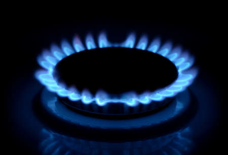 flames of gas stove in the darkの写真素材