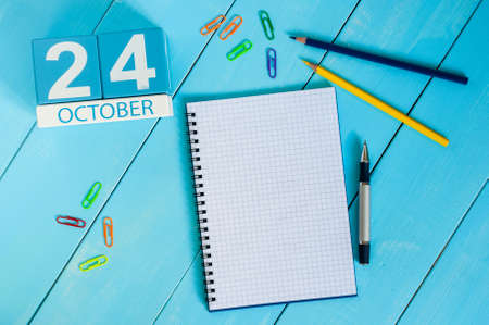 October 24th. Image of October 24 wooden color calendar on blue background. Autumn day. Empty space for text.の写真素材