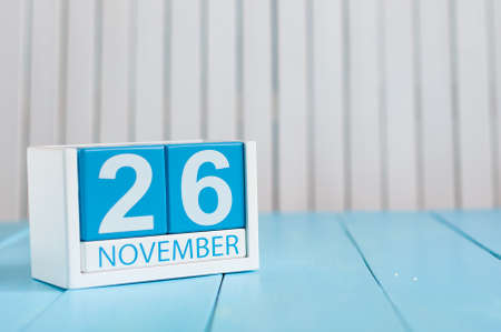 November 26th. Image of november 26 wooden color calendar on blue background. Autumn day. Empty space for text.の写真素材