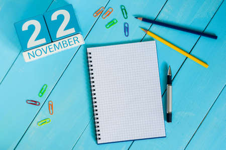 November 22nd. Image of november 22 wooden color calendar on blue background. Autumn day. Empty space for text.の写真素材
