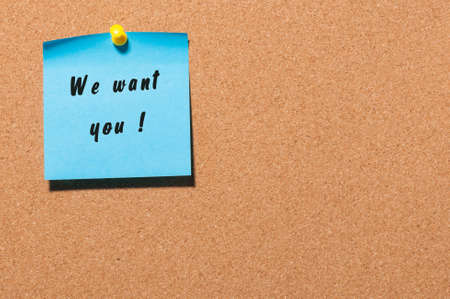 WE WANT YOU message on the sticker pinned at notice cork board.の写真素材