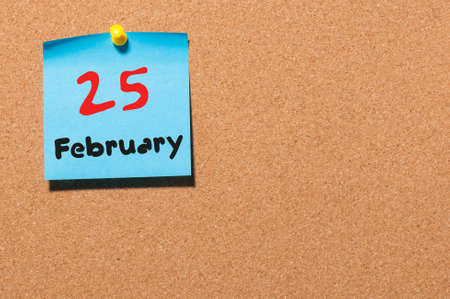 February 25th. Day 25 of month, calendar on cork notice board background. Winter concept. Empty space for text.の写真素材
