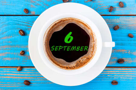 September 6th. Day 6 of month, calendar on morning coffee cup at blue workplace background. Autumn time, Top view.の写真素材