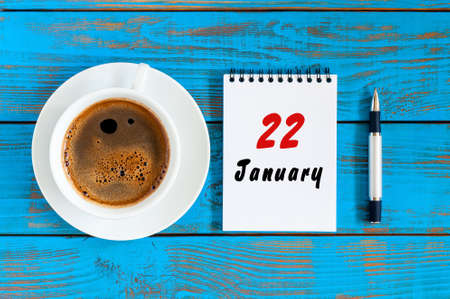 January 22nd. Day 22 of month, calendar on blue wooden office workplace background. Winter concept. Empty space for textの写真素材