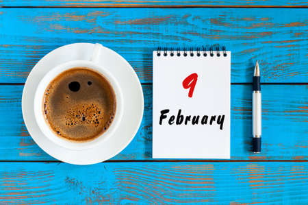 February 9th. Day 9 of month, Top view on calendar and morning coffee cup at workplace background. Winter timeの写真素材