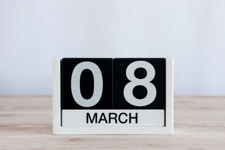 Happy International Womens Days. March 8th. Day 8 of month, everyday calendar on wooden table...