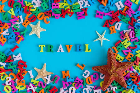 Travel text with starfishes and many color letters. Time to travel text written on photo frame, Summer time and vacation conceptの写真素材