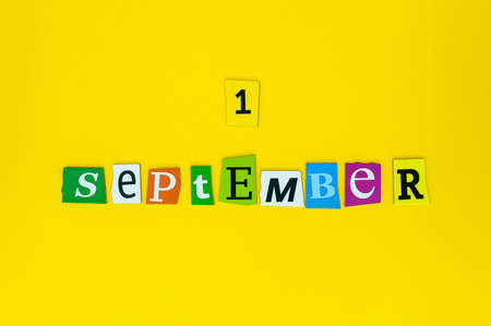 September 1st. Image of september 1 Carved letters calendar on yellow background. Autumn day. Back to school timeの写真素材