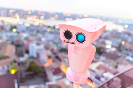 Security CCTV camera, surveillance system at blurred city background. Concept of city security and protection from terrorism and terrorist attacksの写真素材