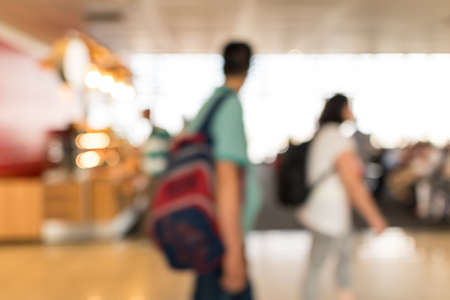 Defocused airport hall with walking travelers. Travel conceptの写真素材