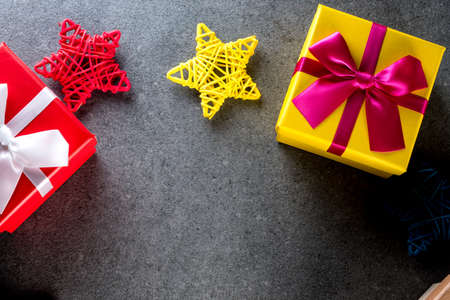 Christmas presents laid on a table background with empty space for text. New year and x-mas holidays conceptの写真素材