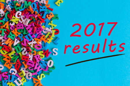 2017 results. Review of the Year. Note at blue surface near many little wooden letters.