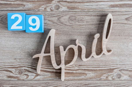 April 29th. Day 29 of month, daily calendar on wooden table background. Spring time themeの写真素材