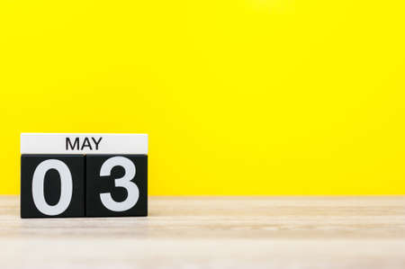May 3rd. Day 3 of may month, calendar on office table with yellow background. Spring timeの写真素材