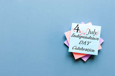 Independence Day Celebration. July 4th. Image of july 4 calendar at blue desk background with copy space. Summer dayの写真素材