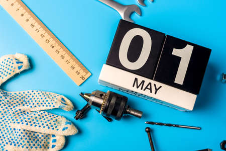 May 1st. Day 1 of may month, calendar on blue background with tools. Labor dayの写真素材