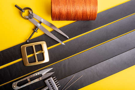 Leather crafting tools still life. Tanners workshop. The concept of small, private business.の写真素材