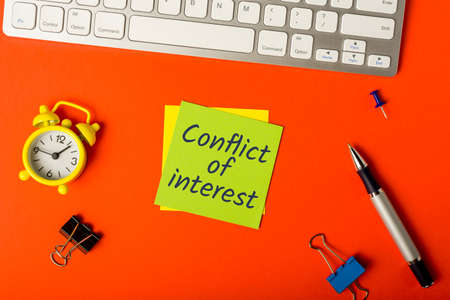 Conflict of Interest written in memo of compliance officer workplace