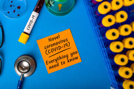 Covid-19 - everything you need to know. Test tubes with blood of a patients with virus. Quarantine Coronavirus pneumoniaの写真素材