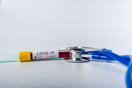 Covid-19 - test tube with blood of a patient with virus. Concept of Quarantine Novel Coronavirus pneumoniaの写真素材