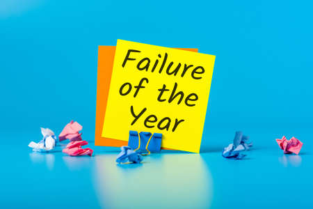 Failure of the year - message at blue workplaceの写真素材