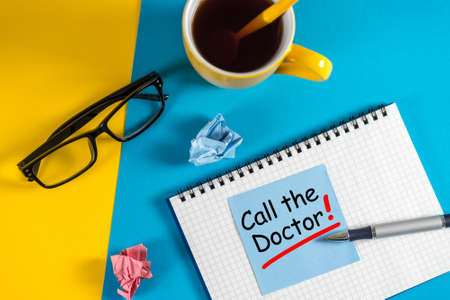 Call the Doctor - note pinned at corkboard. Concept of healthy life 911の写真素材
