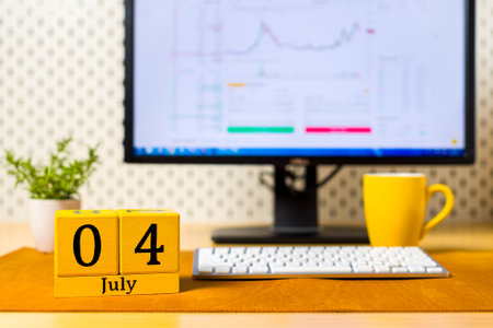 July 4th. Image of july 4 wooden color calendar on office background. Summer day. Day off. Independence Day Of Americaの写真素材