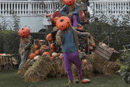 Halloween decoration at Tivoli in Copenhagen, Denmark. . High quality photo Halloween decoration theme in an outdoor public garden, scary pumpkins on the ground.のeditorial素材