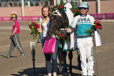 210530 Solvalla - The winner horse of Elitloppet Propulsionand the driver Orjan Kihlstrom win the final of the Elitloppet trotting event at Solvalla track in Stockholm Sweden. High quality photoのeditorial素材