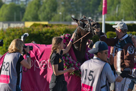 210530 Solvalla - The winner horse of Elitloppet Propulsionand the driver Orjan Kihlstrom win the final of the Elitloppet trotting event at Solvalla track in Stockholm Sweden. High quality photoのeditorial素材